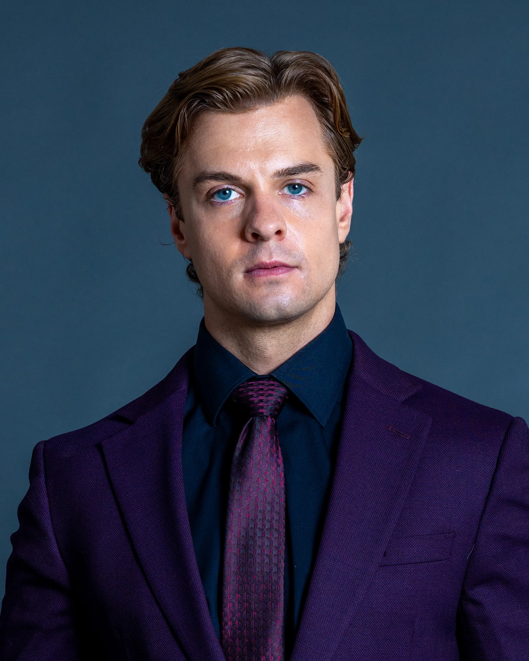 Jake Crossman purple suit headshot