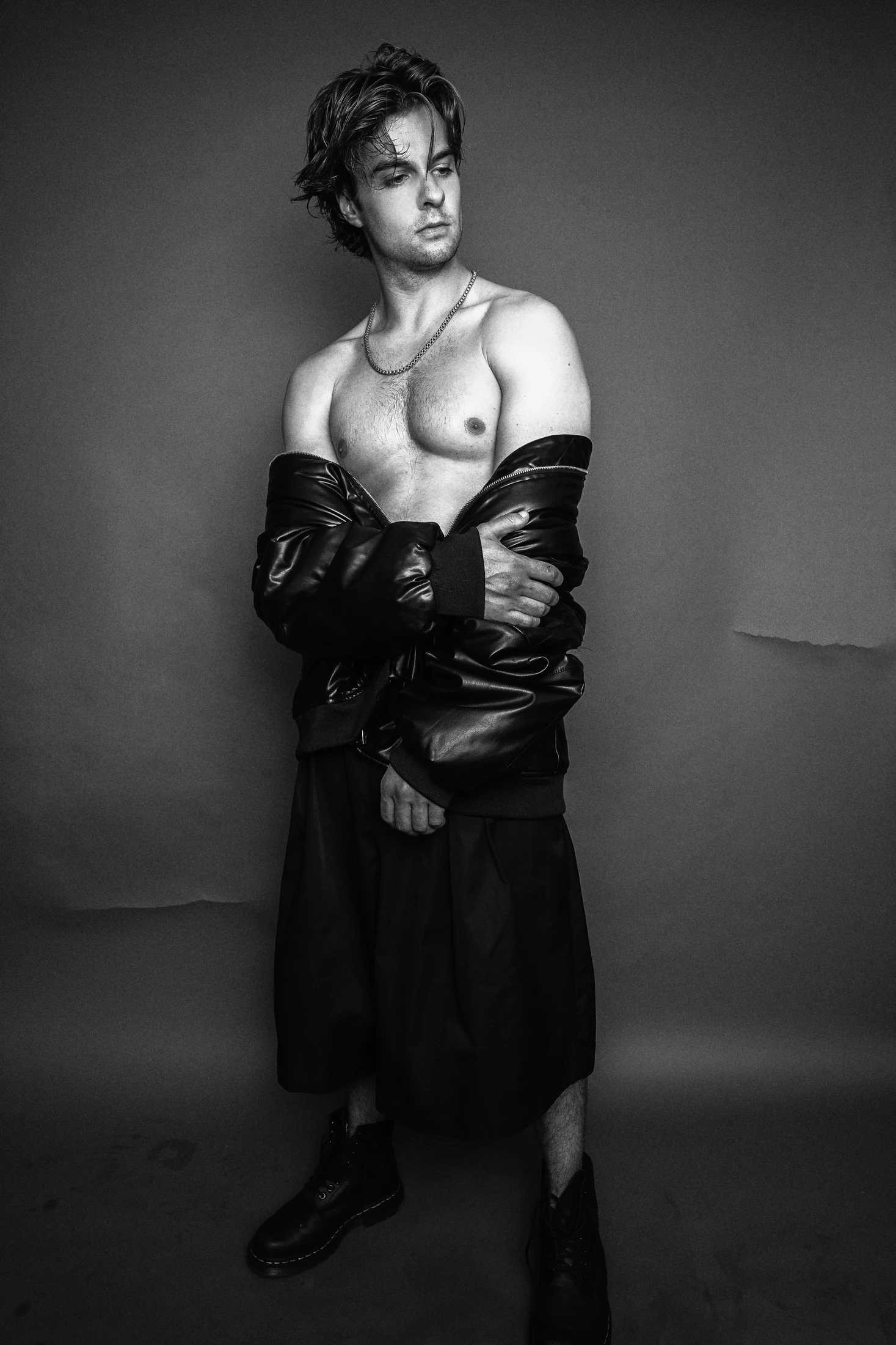 Jake Crossman standing in a black-and-white editorial photograph